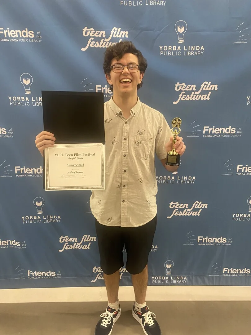 Aiden Chapman receiving the People's Choice Award for "Suavecito 2" at the Yorba Linda Teen Film Festival on March 1st, 2024.